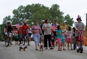 people parading during july 4th, with pets