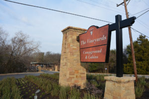 The Vineyards Campground and Cabins sign at entrance