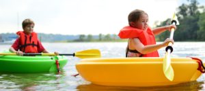 kids in paddling boats
